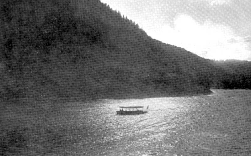 Moonlight on the Delaware River as a boat travels through the Delaware Water Gap, circa 1910.