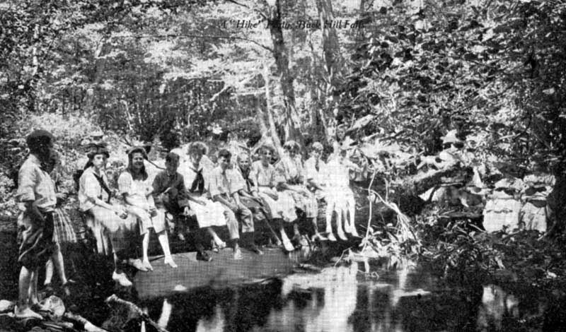 Young people cool off by the river, circa 1912.