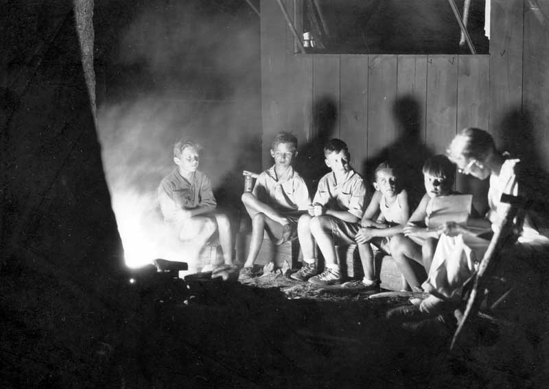 Storytelling around the campfire, 1930.