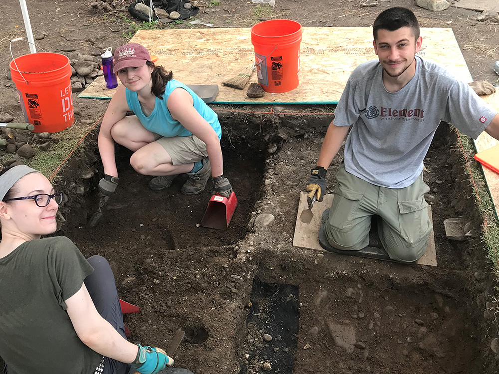 Amelia Potetz, Rachel Mignona, and Dakota Kalavoda work in one of the test units during the archaeological dig at the Stroud Mansion.