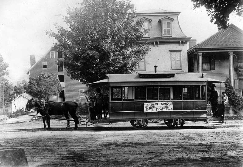 Horsedrawn trolley with Ackerman’s Flour Mill to the left, circa 1892.
